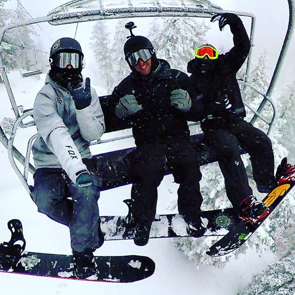 Group of snowboarders on a chairlift